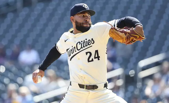 Minnesota Twins starting pitcher Simeon Woods Richardson delivers against the Detroit Tigers during the first inning of a baseball game Sunday, April 13, 2025, in Minneapolis. (AP Photo/Matt Krohn)