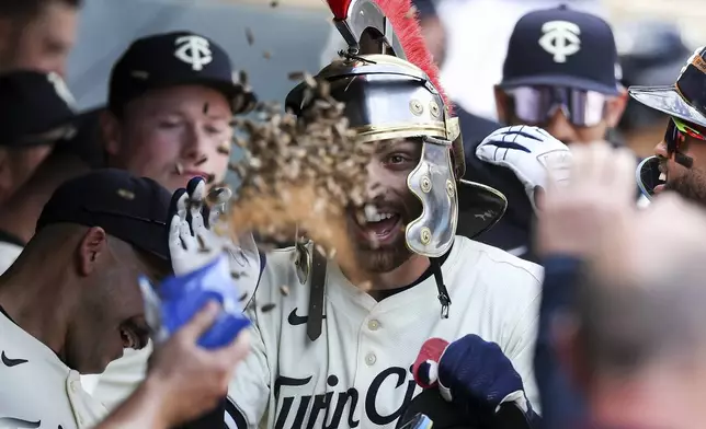 Minnesota Twins' Edouard Julien celebrates his solo home run during the sixth inning of a baseball game against the Detroit Tigers Sunday, April 13, 2025, in Minneapolis. (AP Photo/Matt Krohn)