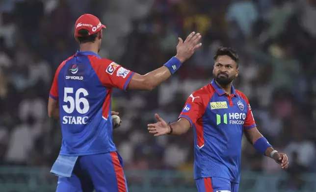 Delhi Capitals' Mukesh Kumar celebrates with Mitchell Starc the wicket of Lucknow Super Giants' Ayush Badoni during the Indian Premier League cricket match between Lucknow Super Giants and Delhi Capitals at Atal Bihari Vajpayee Ekana Cricket Stadium in Lucknow, India, Tuesday, April 22, 2025. (AP Photo)