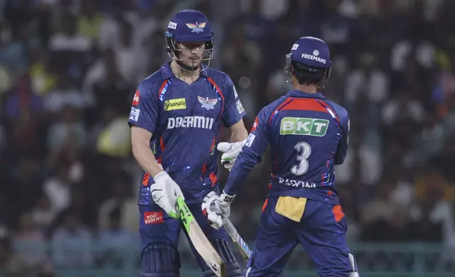 Lucknow Super Giants' David Miller, left, and Ayush Badoni encourages each other as they bat during the Indian Premier League cricket match between Lucknow Super Giants and Delhi Capitals at Atal Bihari Vajpayee Ekana Cricket Stadium in Lucknow, India, Tuesday, April 22, 2025. (AP Photo)