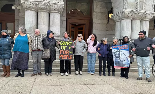 People gather to demonstrate the arrest of Judge Hannah Dugan, outside the Federal courthouse in Milwaukee on Friday, April 25, 2025. (AP Photo/Devi Shastri)