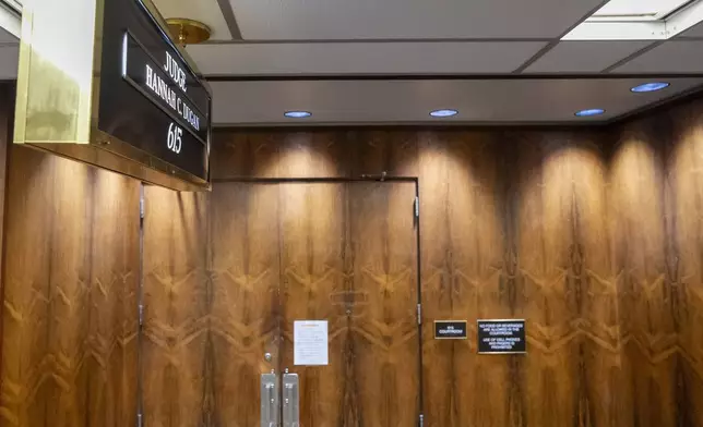 A sign is posted on the doors of Judge Hannah Dugan courtroom Friday, April 25, 2025, in Milwaukee. (AP Photo/Andy Manis)