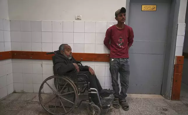 Mohamed Attiya, 54, waits for a dialysis session next to his son, Wasem, at Shifa hospital in Gaza City, Monday, April 14, 2025.(AP Photo/(AP Photo/Jehad Alshrafi)