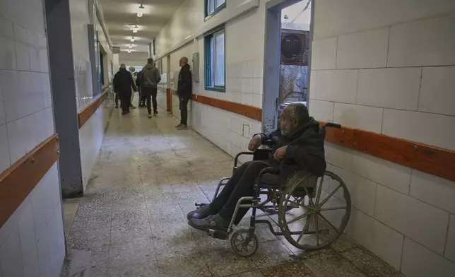Mohamed Attiya, 54, waits for a dialysis session in a corridor at Shifa hospital in Gaza City, Monday, April 14, 2025.(AP Photo/(AP Photo/Jehad Alshrafi)