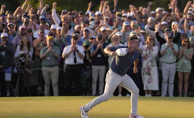 Rory McIlroy, of Northern Ireland, reacts after winning in a playoff against Justin Rose after the final round at the Masters golf tournament, Sunday, April 13, 2025, in Augusta, Ga. (AP Photo/Ashley Landis)