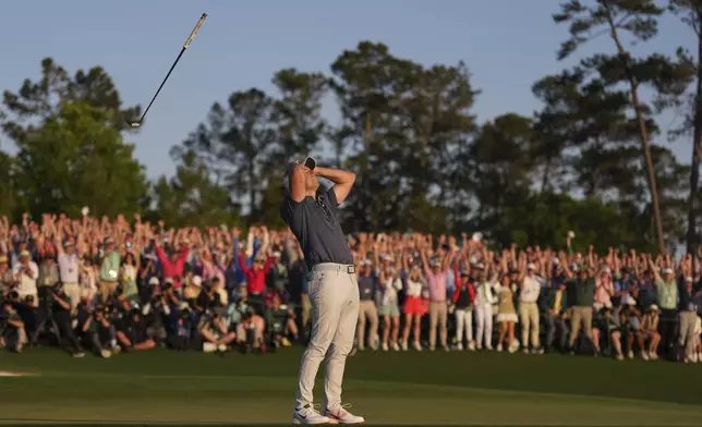 Rory McIlroy, of Northern Ireland, reacts after winning in a playoff against Justin Rose after the final round at the Masters golf tournament, Sunday, April 13, 2025, in Augusta, Ga. (AP Photo/Matt Slocum)
