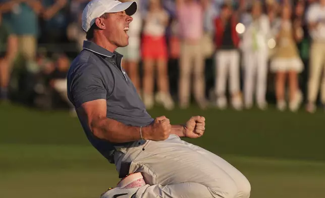 Rory McIlroy, of Northern Ireland, celebrates winning in a playoff against Justin Rose, of England, after the final round the Masters golf tournament, Sunday, April 13, 2025, in Augusta, Ga. (AP Photo/Matt Slocum)