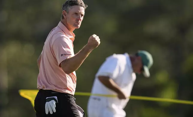 Justin Rose celebrates after a birdie on the 18th hole during the final round at the Masters golf tournament, Sunday, April 13, 2025, in Augusta, Ga. (AP Photo/David J. Phillip)