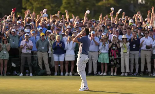 Rory McIlroy, of Northern Ireland, reacts after winning in a playoff against Justin Rose after the final round at the Masters golf tournament, Sunday, April 13, 2025, in Augusta, Ga. (AP Photo/Ashley Landis)