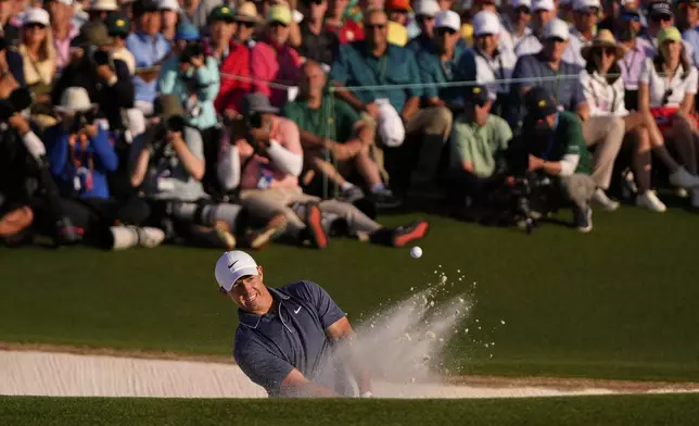 Rory McIlroy, of Northern Ireland, hits from the bunker on the 18th hole during the final round at the Masters golf tournament, Sunday, April 13, 2025, in Augusta, Ga. (AP Photo/Julia Demaree Nikhinson)
