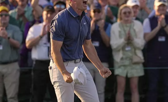 Rory McIlroy, of Northern Ireland, reacts after winning in a playoff against Justin Rose after the final round at the Masters golf tournament, Sunday, April 13, 2025, in Augusta, Ga. (AP Photo/Ashley Landis)