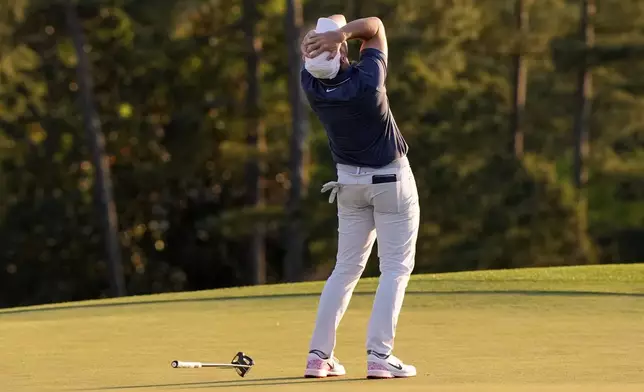 Rory McIlroy, of Northern Ireland, celebrates winning in a playoff against Justin Rose, of England, after the final round the Masters golf tournament, Sunday, April 13, 2025, in Augusta, Ga. (AP Photo/David J. Phillip)