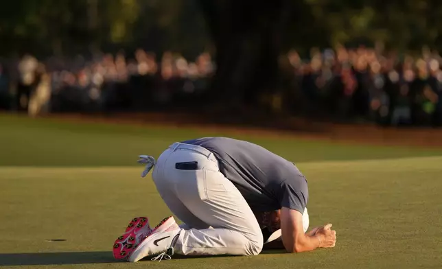 Rory McIlroy, of Northern Ireland, celebrates winning in a playoff against Justin Rose, of England, after the final round the Masters golf tournament, Sunday, April 13, 2025, in Augusta, Ga. (AP Photo/Julia Demaree Nikhinson)