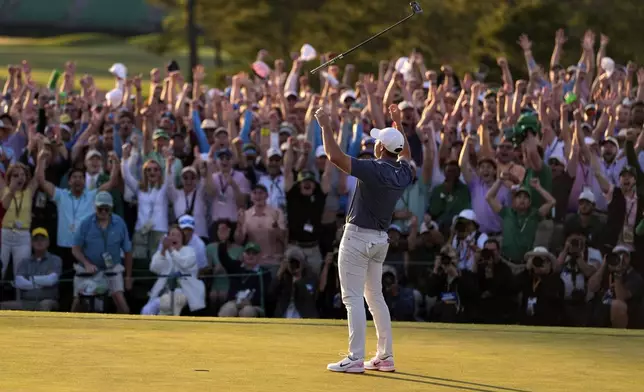 Rory McIlroy, of Northern Ireland, celebrates winning in a playoff against Justin Rose, of England, after the final round the Masters golf tournament, Sunday, April 13, 2025, in Augusta, Ga.(AP Photo/Ashley Landis)