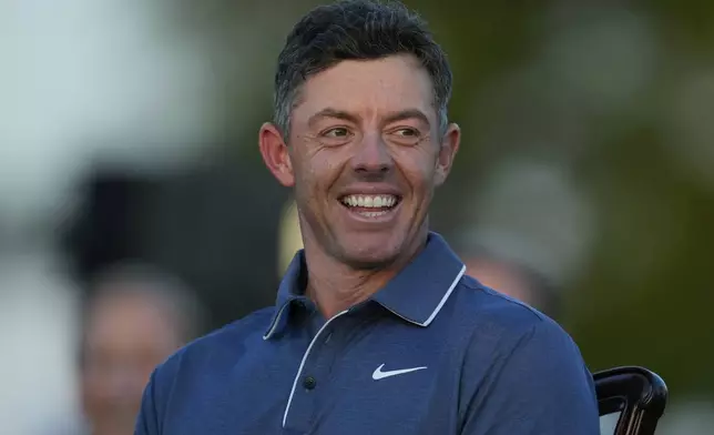 Rory McIlroy, of Northern Ireland, waits to put on the green Jacket after winning the Masters golf tournament, Sunday, April 13, 2025, in Augusta, Ga. (AP Photo/Ashley Landis)
