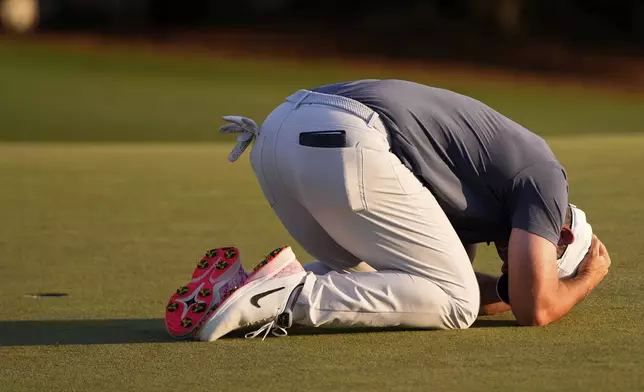 Rory McIlroy, of Northern Ireland, reacts after winning in a playoff against Justin Rose after the final round at the Masters golf tournament, Sunday, April 13, 2025, in Augusta, Ga. (AP Photo/Julia Demaree Nikhinson)