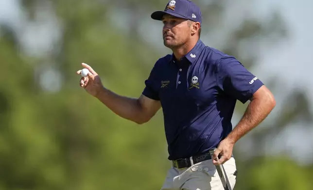 Bryson DeChambeau waves after making a putt on the eighth hole during the final round at the Masters golf tournament, Sunday, April 13, 2025, in Augusta, Ga. (AP Photo/Ashley Landis)