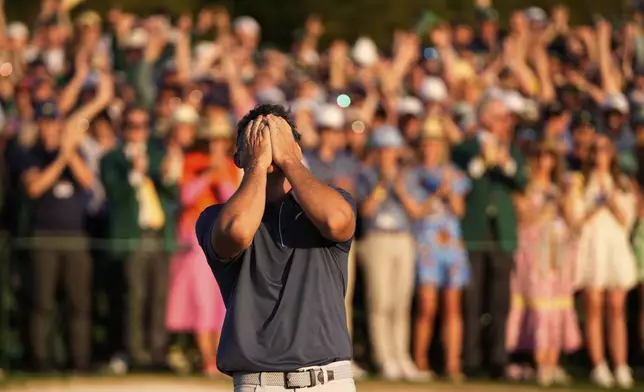 Rory McIlroy, of Northern Ireland, celebrates winning in a playoff against Justin Rose, of England, after the final round the Masters golf tournament, Sunday, April 13, 2025, in Augusta, Ga. (AP Photo/Julia Demaree Nikhinson)