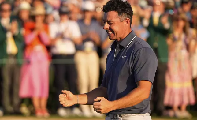 Rory McIlroy, of Northern Ireland, celebrates winning in a playoff against Justin Rose, of England, after the final round the Masters golf tournament, Sunday, April 13, 2025, in Augusta, Ga. (AP Photo/Julia Demaree Nikhinson)