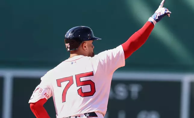 Boston Red Sox's Carlos Narváez gestures as he rounds the bases after hitting a home run during the eighth inning of a baseball game against the Seattle Mariners, Thursday, April 24, 2025, in Boston. (AP Photo/Mark Stockwell)
