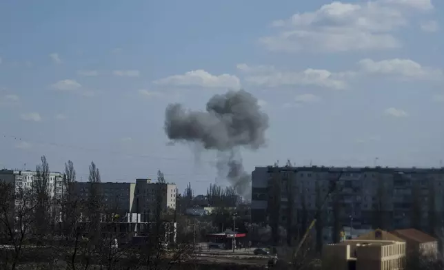 Smoke rises from an explosion following a Russian drone strike on Sumy, Ukraine, Monday, April 14, 2025. (AP Photo/Evgeniy Maloletka)