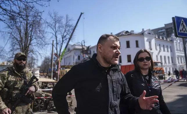 Ukrainian Interior Minister Ihor Klymenko visits the site of the Russian missile attack in Sumy, Ukraine, Monday, April 14, 2025. (AP Photo/Evgeniy Maloletka)