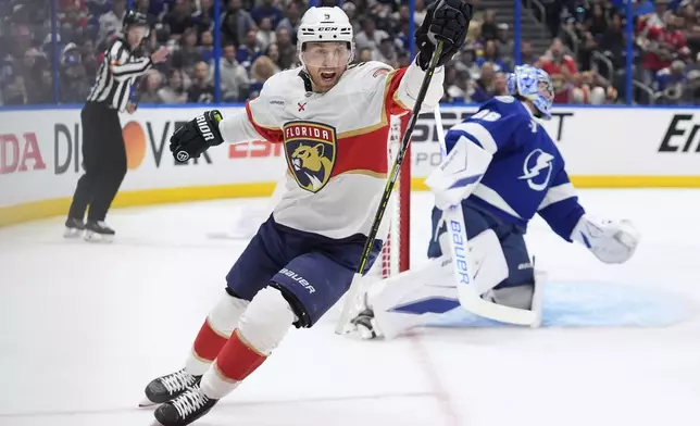 Florida Panthers center Sam Bennett (9) celebrates after scoring past Tampa Bay Lightning goaltender Andrei Vasilevskiy (88) during the first period in Game 1 of an NHL hockey Stanley Cup first-round playoff series, Tuesday, April 22, 2025, in Tampa, Fla. (AP Photo/Chris O'Meara)