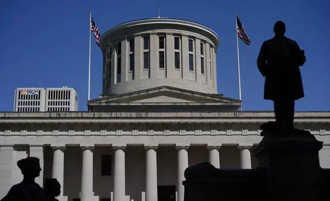 FILE - The William McKinley Monument is silhouetted in front of the west side of the Ohio Statehouse, April 15, 2024, in Columbus, Ohio. (AP Photo/Carolyn Kaster, File)