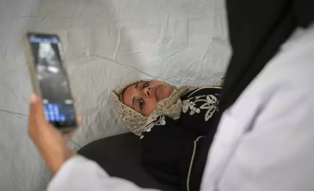 Islam Sheih Al-Eid, 27, who is six months pregnant, undergoes an ultrasound scan at the Médecins Sans Frontières (MSF) clinic in Muwasi, near Khan Younis in the southern Gaza Strip, Wednesday, April 9, 2025. (AP Photo/Abdel Kareem Hana)