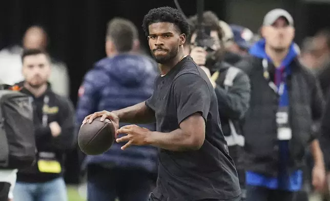 FILE - Colorado quarterback Shedeur Sanders takes part in passing drills during Colorado's NFL football pro day Friday, April 4, 2025, in Boulder, Colo. (AP Photo/David Zalubowski, File)