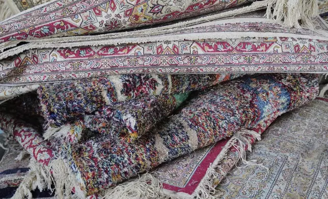 Kashmiri hand-knotted carpets wait to be sheared at a workshop in Srinagar, Indian controlled Kashmir, on April 12, 2025. (AP Photo/Dar Yasin)