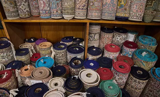 Kashmiri hand-knotted carpets are stored at a showroom in Srinagar, Indian controlled Kashmir, on April 14, 2025. (AP Photo/Dar Yasin)
