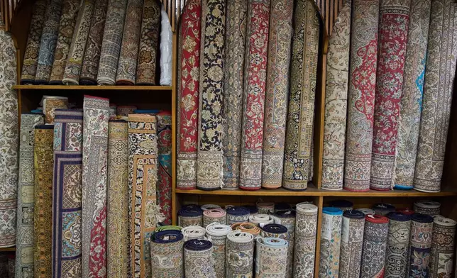 Kashmiri hand-knotted carpets are displayed at a showroom in Srinagar, Indian controlled Kashmir, on April 14, 2025. (AP Photo/Dar Yasin)