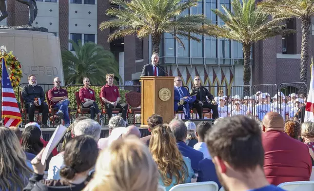 The day after an active shooter on campus Florida State president Richard McCullough addresses a vigil on campus at Langford Green, Tallahassee, Fla., Friday, April 18, 2025. (AP Photo/Gary McCullough)