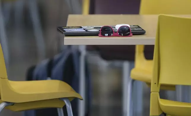 Sunglasses and a computer left by by a student are shown inside the Florida State Student Union building in Tallahassee, Fla., Friday, April 18, 2025. (AP Photo/Gary McCullough)