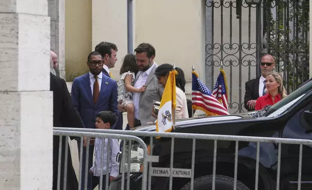 U.S. Vice President JD Vance, centre, his wife Usha and their children arrive at the Basilica of Saint Paul Outside The Walls in Rome, Sunday, April 20, 2025. (AP Photo/Alessandra Tarantino)