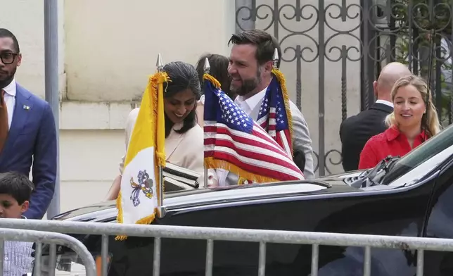 U.S. Vice President JD Vance, centre, his wife Usha and their children arrive at the Basilica of Saint Paul Outside The Walls in Rome, Sunday, April 20, 2025. (AP Photo/Alessandra Tarantino)