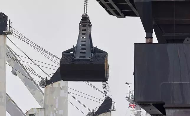 Coking coal is unloaded at Immingham Port, northern England, Tuesday, April 15, 2025. (Darren Staples/Pool Photo via AP)