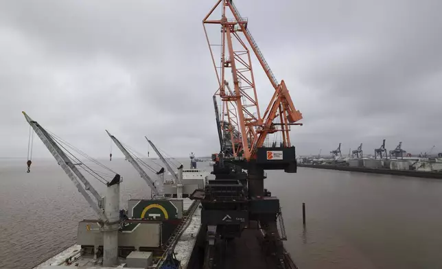 Coking coal is unloaded at Immingham Port, northern England, Tuesday, April 15, 2025. (Darren Staples/Pool Photo via AP)