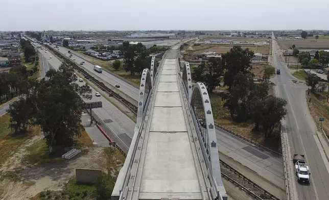 The Cedar Viaduct, designed to take high-speed trains over Cedar and North avenues and State Route 99, is shown in an aerial view, Tuesday, April 15, 2025, in Fresno, Calif. (AP Photo/Godofredo A. Vásquez)