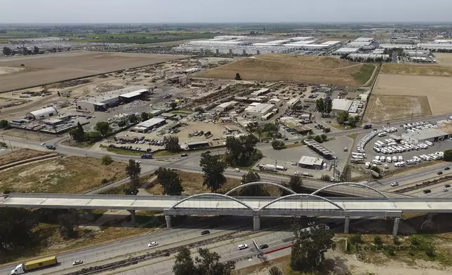 The Cedar Viaduct, designed to take high-speed trains over Cedar and North avenues and State Route 99, is shown in an aerial view, Tuesday, April 15, 2025, in Fresno, Calif. (AP Photo/Godofredo A. Vásquez)