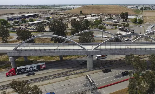 The Cedar Viaduct, designed to take high-speed trains over Cedar and North avenues and State Route 99, is shown in an aerial view, Tuesday, April 15, 2025, in Fresno, Calif. (AP Photo/Godofredo A. Vásquez)