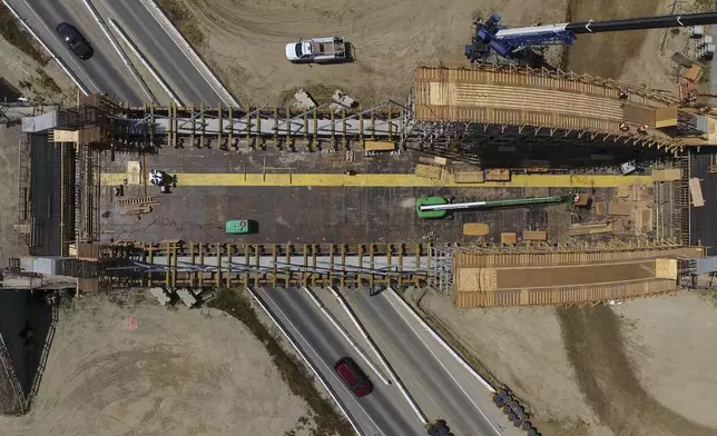 The Tied Arch Bridge construction site, which will take high-speed trains over State Route 43, is shown in an aerial view, Tuesday, April 15, 2025, in Fresno County, Calif. (AP Photo/Godofredo A. Vásquez)
