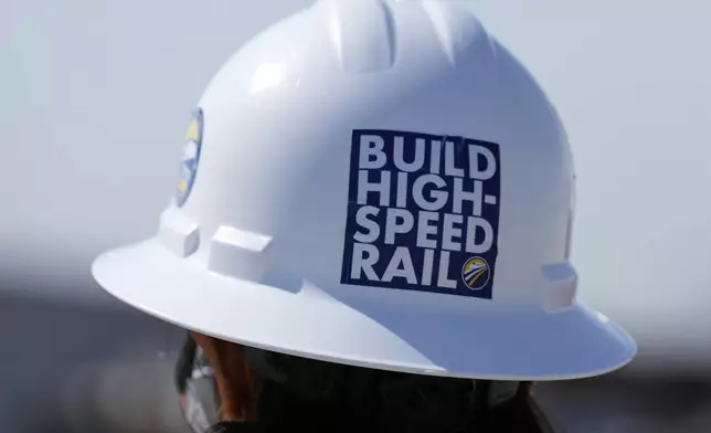A California High-Speed Rail Authority worker walks through the Hanford Viaduct construction site, Tuesday, April 15, 2025, in Kings County, Calif. (AP Photo/Godofredo A. Vásquez)
