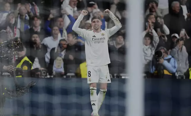 Real Madrid's Federico Valverde celebrates scoring his side's opening goal during the Spanish La Liga soccer match between Real Madrid and Athletic Bilbao at the Santiago Bernabeu stadium in Madrid, Sunday, April 20, 2025. (AP Photo/Manu Fernandez)