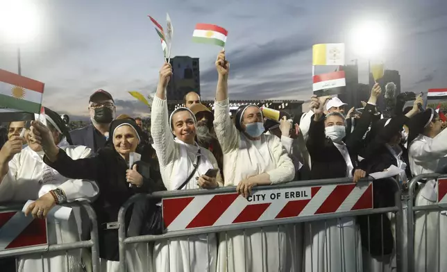 FILE.- Iraqi Christians say goodbye to Pope Francis after an open air Mass at a stadium in Irbil, Iraq, Sunday, March 7, 2021. (AP Photo/Hadi Mizban,File)
