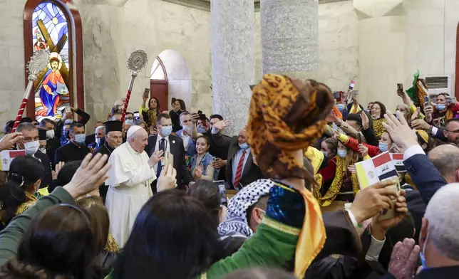FILE.- Pope Francis arrives at a meeting with the Qaraqosh community at the Church of the Immaculate Conception, in Qaraqosh, Iraq, Sunday, March 7, 2021. (AP Photo/Andrew Medichini,File)