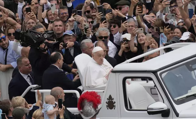 Pope Francis tours St. Peter's Square in his popemobile after bestowing the Urbi et Orbi (Latin for to the city and to the world) blessing at the end of the Easter mass presided over by Cardinal Angelo Comastri in St. Peter's Square at the Vatican Sunday, April 20, 2025.(AP Photo/Gregorio Borgia)