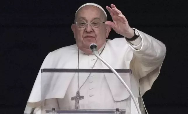 FILE - Pope Francis delivers his blessing as he recites the Angelus noon prayer from the window of his studio overlooking St.Peter's Square, at the Vatican, Sunday, Jan. 19, 2025. (AP Photo/Andrew Medichini, file)