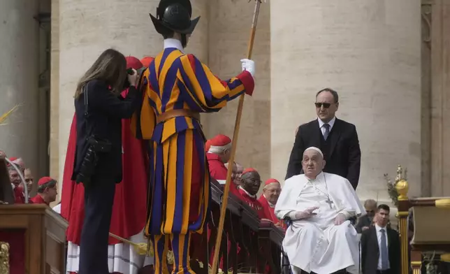 Pope Francis arrives at the end of the mass on Palm Sunday in St. Peter's Square at The Vatican, Sunday, April 13, 2025. (AP Photo/Gregorio Borgia)